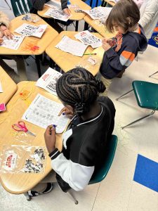Third Third-grade students  creating Binary Kits with Rosie Riveters. Students Binary Kits